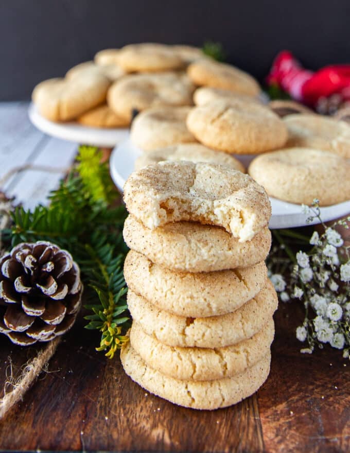Stack of sugar cookies with the top one bitten off to show the texture inside 