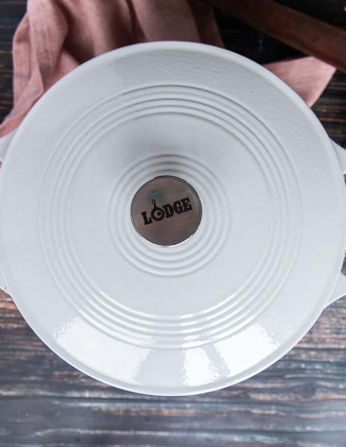 A lid covering the skillet to cook the rapini fully