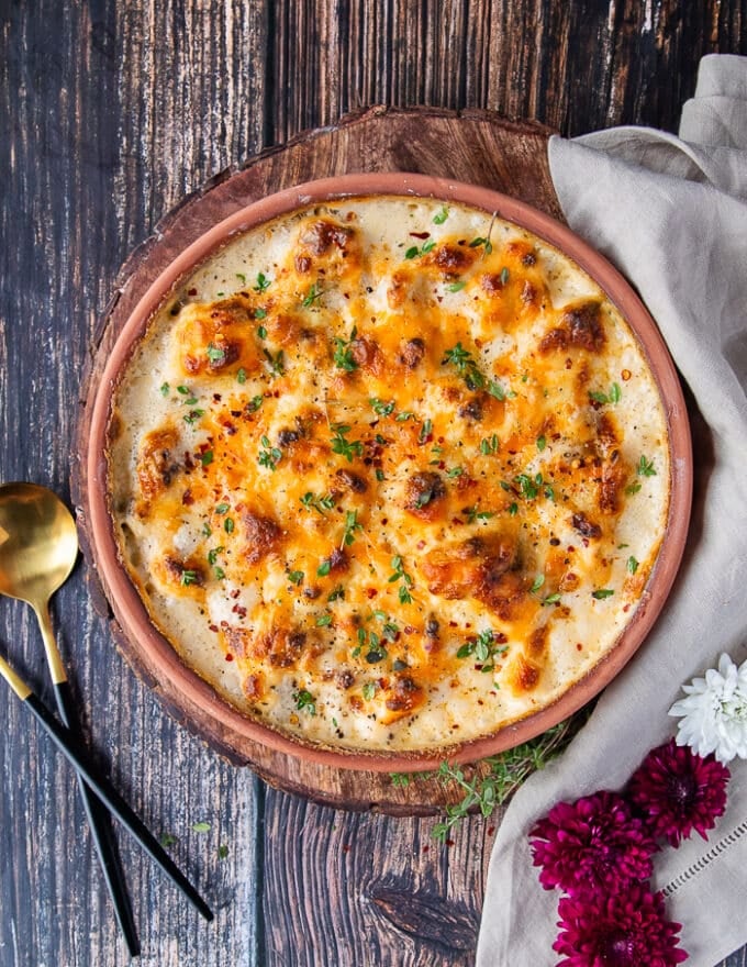 The cauliflower casserole right our of the oven, bubbling hot and golden on top with the cheese melted. 
