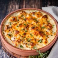 side view of the cauliflower casserole out of the oven with golden tops