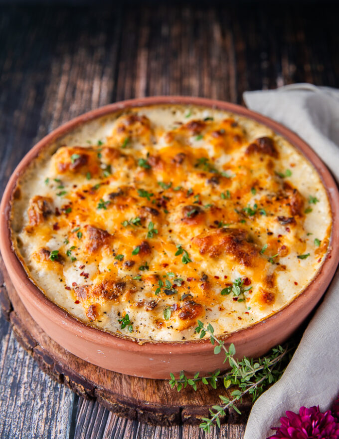 side view of the cauliflower casserole out of the oven with golden tops