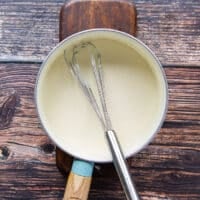The butter and flour cooking in a pot as a base to the sauce for cauliflower casserole