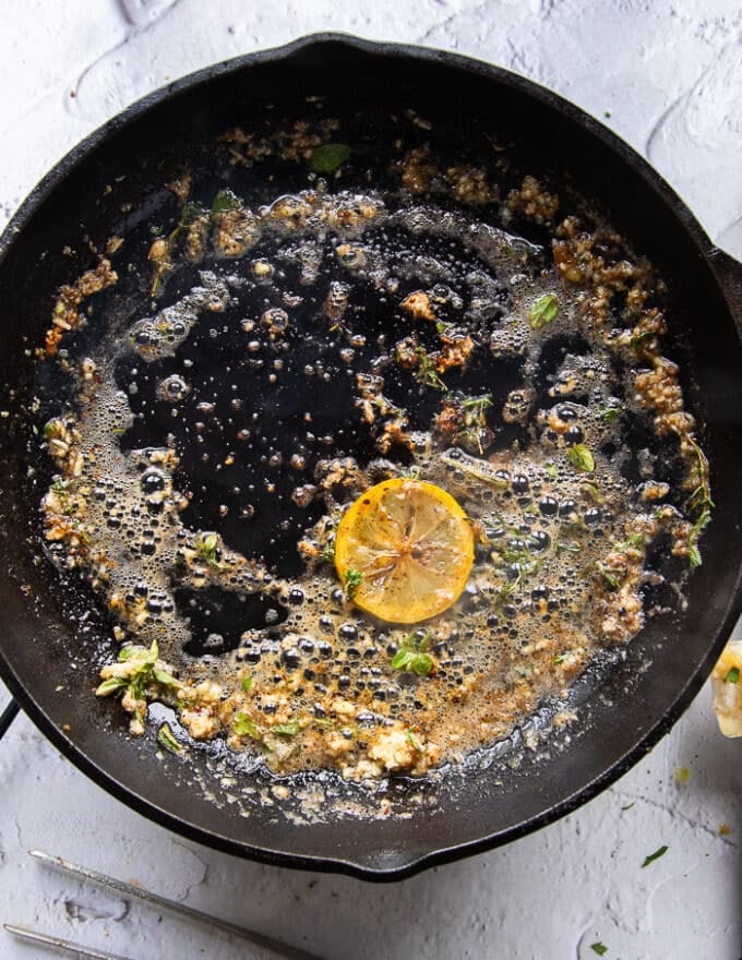 Crab pasta sauce is made in the same skillet by adding butter, garlic and lemon slice