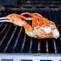 seasoned crab legs on the grill