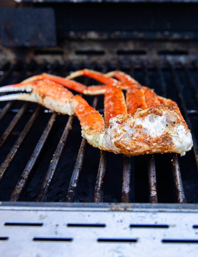 seasoned crab legs on the grill