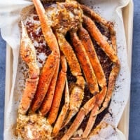 baked crab legs out of the oven ready to eat