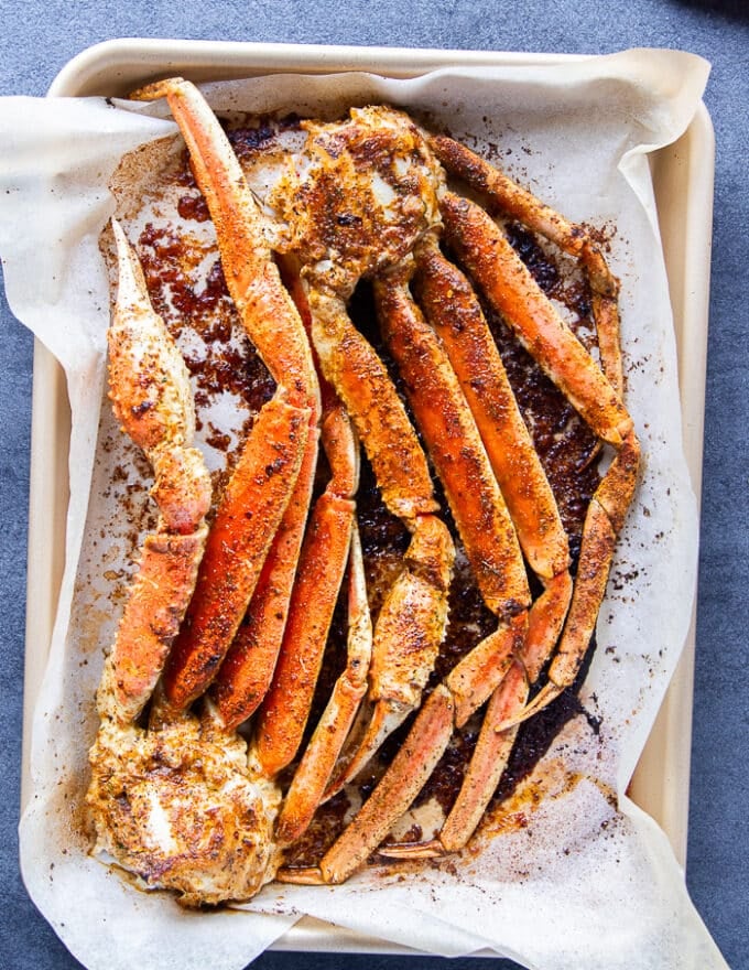 baked crab legs out of the oven ready to eat