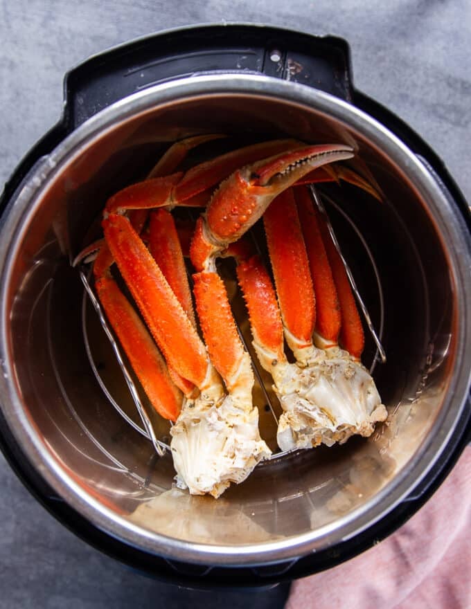 steamed crab legs ready in a steamer pot 