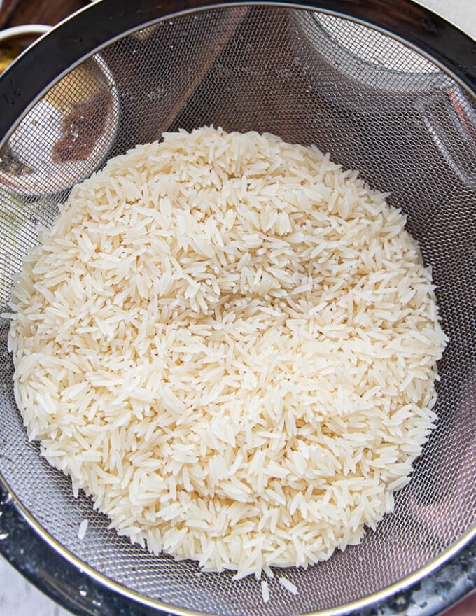 long grain basmati rice rinsed and drained in a colander 