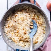 The rinsed rice added to the pan to be sautéed with the remaining ingredients very well before proceeding