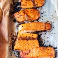 maple glazed salmon fillets on a baking sheet right out of the oven fully cooked