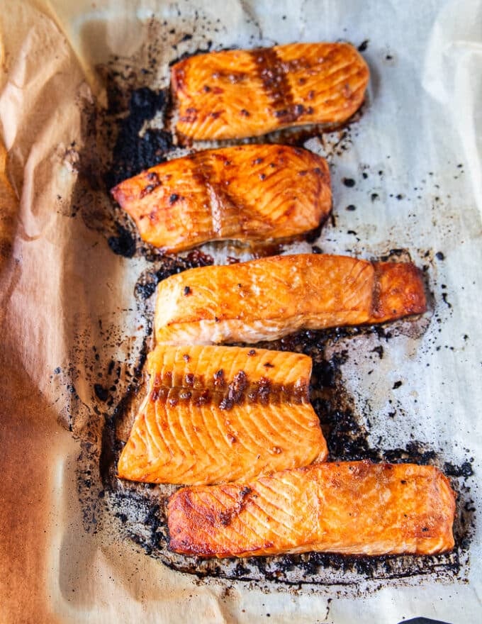 maple glazed salmon fillets on a baking sheet right out of the oven fully cooked 
