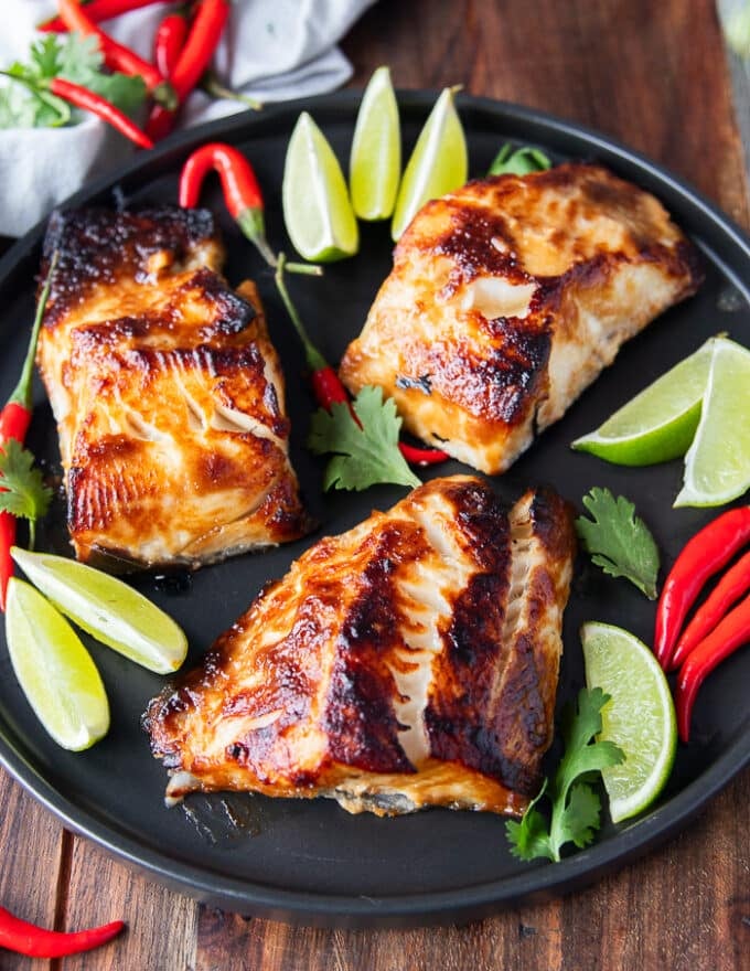 close up of miso cod cooked perfectly showing the golden color of the marinade and the flakey texture of black cod 
