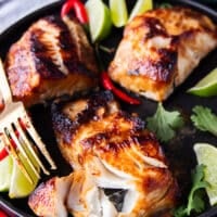 A fork flaking the miso cod showing how buttery the black cod is