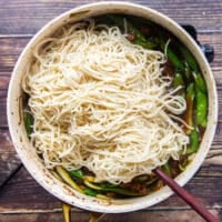 cooked noodles are added into the skillet with the Mongolian ground beef