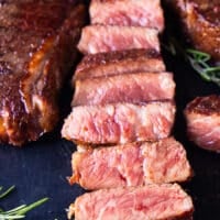 close up of a sliced reverse sear steak showing the perfect pink inside and golden sear
