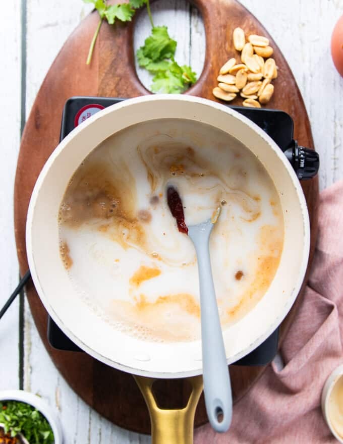 All satay sauce ingredients are added into a pot 