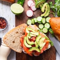 the final topping is the avocado which is placed right over the smoked salmon and now the smoked salmon sandwich is layered