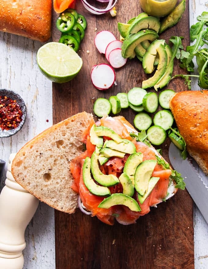 the final topping is the avocado which is placed right over the smoked salmon and now the smoked salmon sandwich is layered 