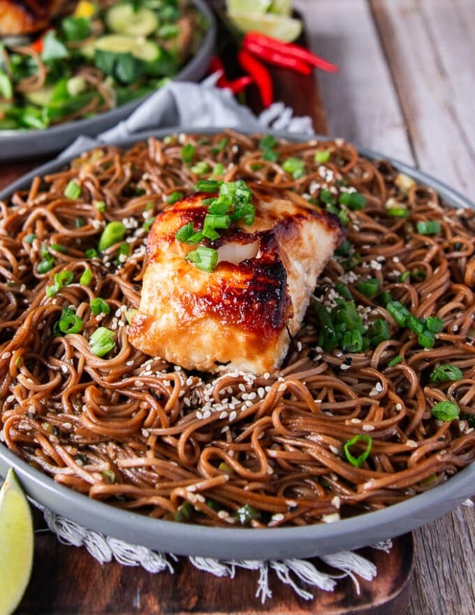 The sesame noodles recipe plated and garnished with lots of sesame seeds, and served with miso cod optionally.