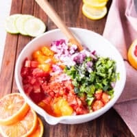 All the citrus salsa ingredients added to one bowl at the same time
