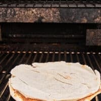 The thin pita on the grill cooking