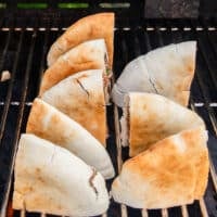The arayes are arranged on the grill to cook
