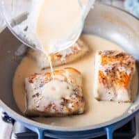 the cooked black cod is returned to the skillet and the creamy lemon beurre blanc sauce is poured right over it