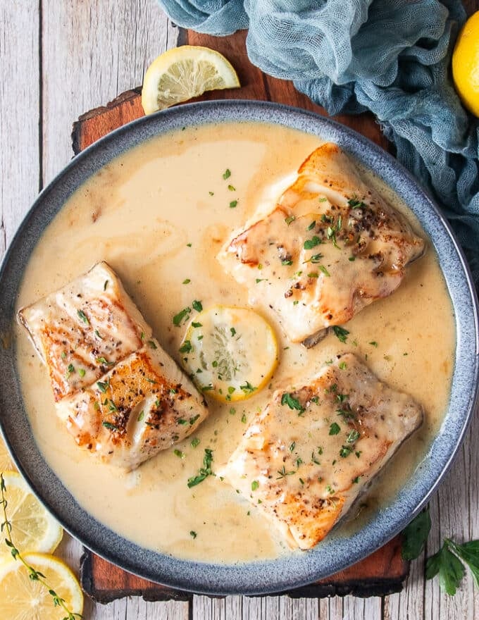 top view of the black cod recipe with the fish cooked perfectly in a beurre blanc sauce