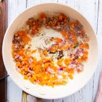In the same skillet the cajun pasta sauce is cooking by sautéing onions and bell peppers