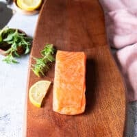 A whole salmon fresh sushi grade, partially frozen and ready to slice for salmon carpaccio