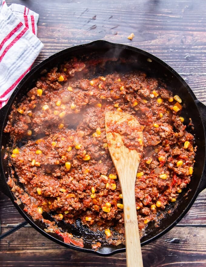 taco meat and sauce is now ready in a cast iron skillet 