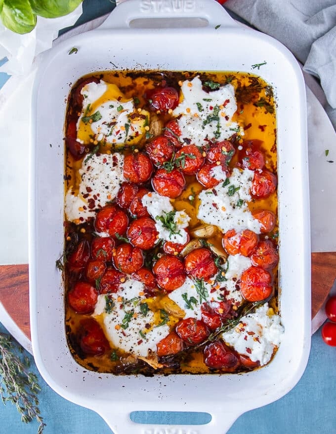 the tomatoes out of the oven softened and ready to add mozzarella 