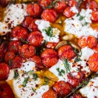 close up of a warm tomato, mozzarella, basil and chilli flakes mixture to spread over the toast