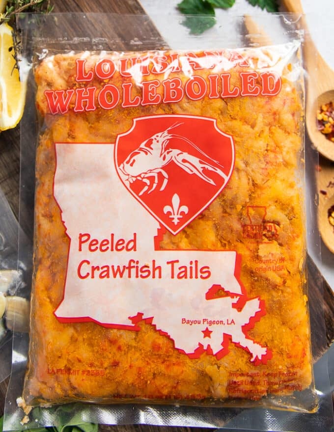 A bag of thawed crawfish tail meat showing the meat and how it looks like close up and defrosted