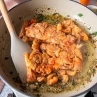 the crawfish tail meat is added to the skillet