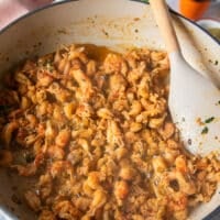 The crawfish tail meat is cooking in the skillet and has absorbed all the flavors