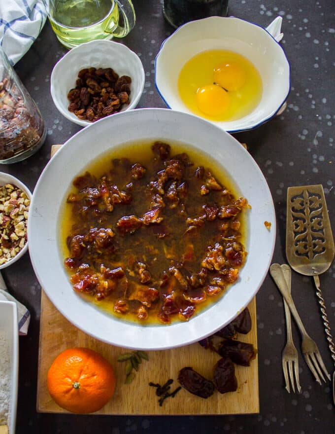 Date cake step by step beginning with dates in a bowl soaked in hot boiling water 