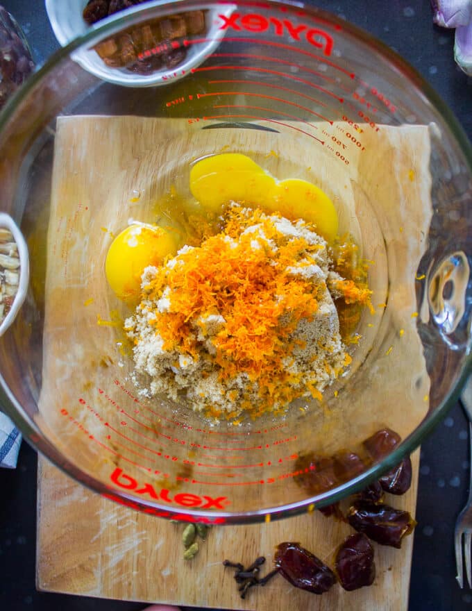 date cake wet ingredients in the bowl starting with eggs and sugar