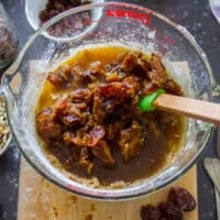 The dates soaking in hot water are added to the batter