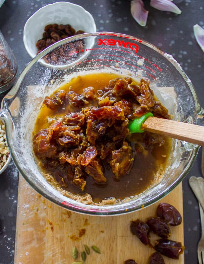 The dates soaking in hot water are added to the batter 