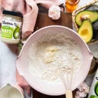 The mayonnaise and milk are added to the flour mixture in the large bowl
