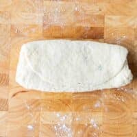 the second third of the dough is folded over