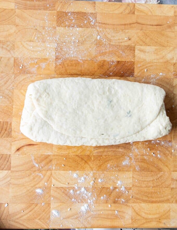 the second third of the dough is folded over 