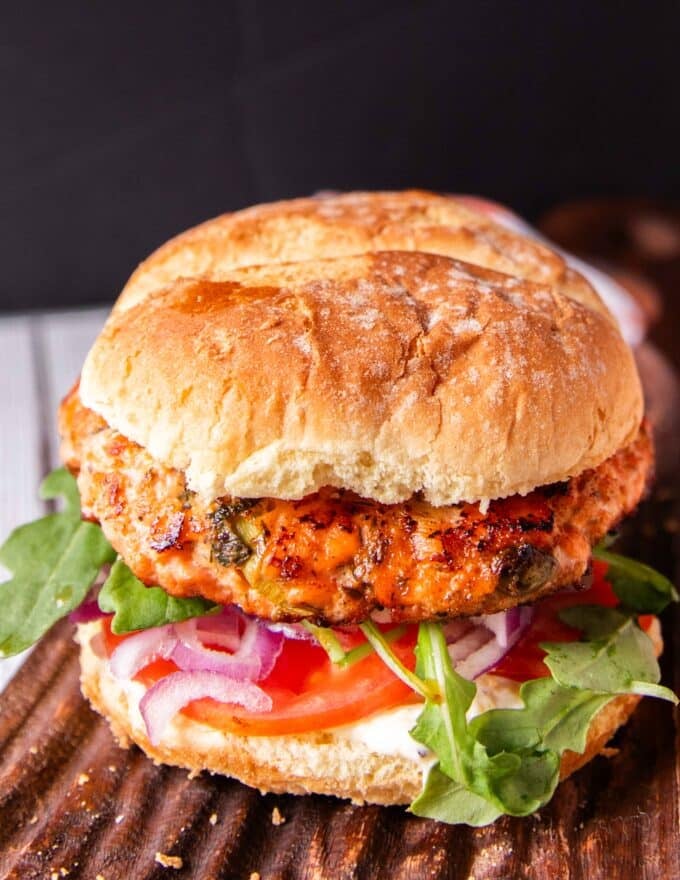 Grilled salmon burger on brioche bun