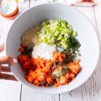 All the salmon burgers ingredients are added into a bowl