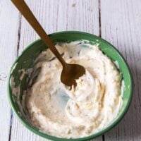 salmon burger sauce , or lemon aioli ready in a bowl