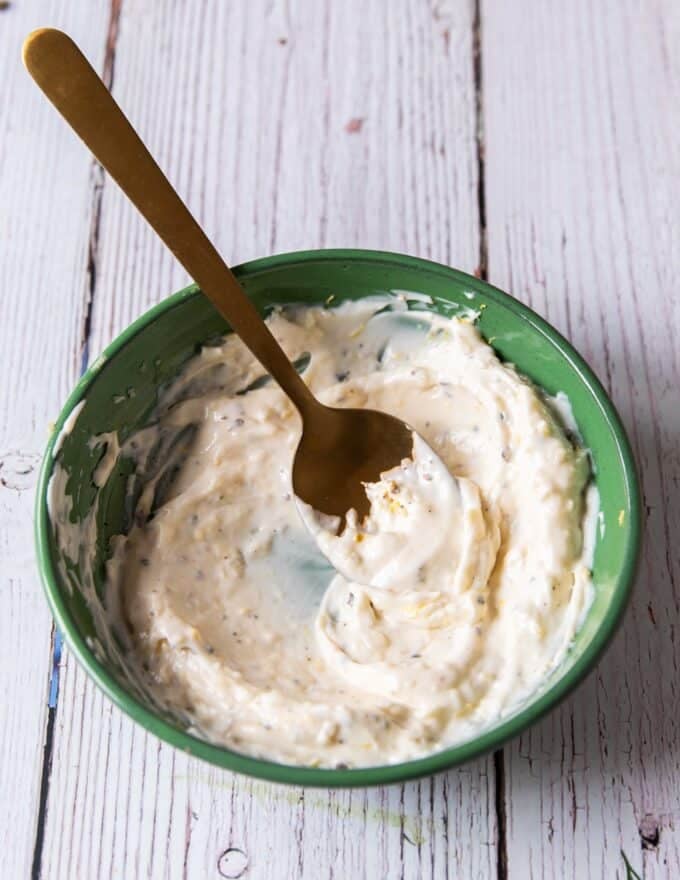 salmon burger sauce , or lemon aioli ready in a bowl 