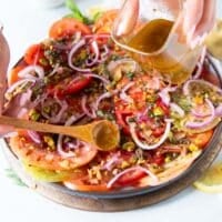 dressing or balsamic vinegar or olive oil only poured over the carpaccio