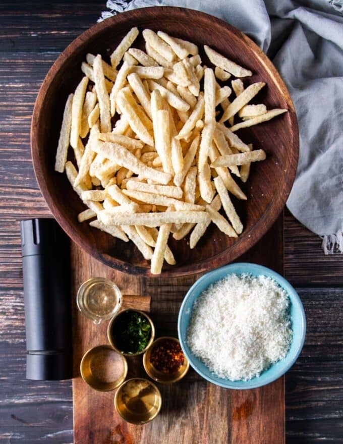 Truffle fries ingredients : frozen french fries, truffle oil, grated parmesan cheese, minced garlic , salt and pepper, some minced parsley